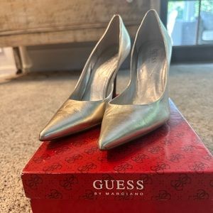 Gold, shiny Guess pumps. Size 7. Great condition.